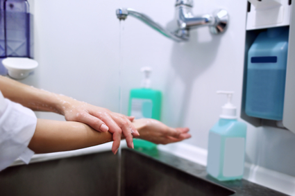 surgeon washing hands sink